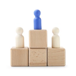 Photo of Human figures on wooden blocks, blue one on top against white background. Competition concept