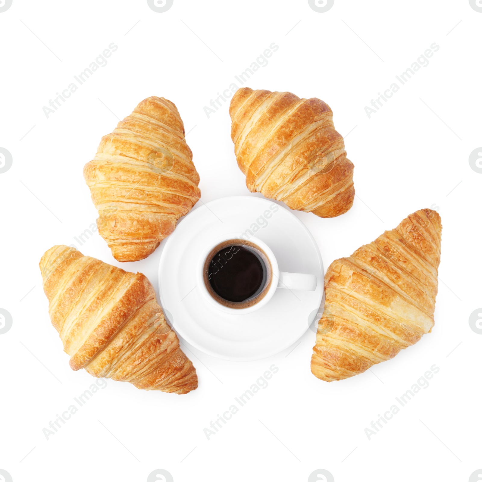 Photo of Tasty fresh croissants and cup of coffee isolated on white, top view. Puff pastry