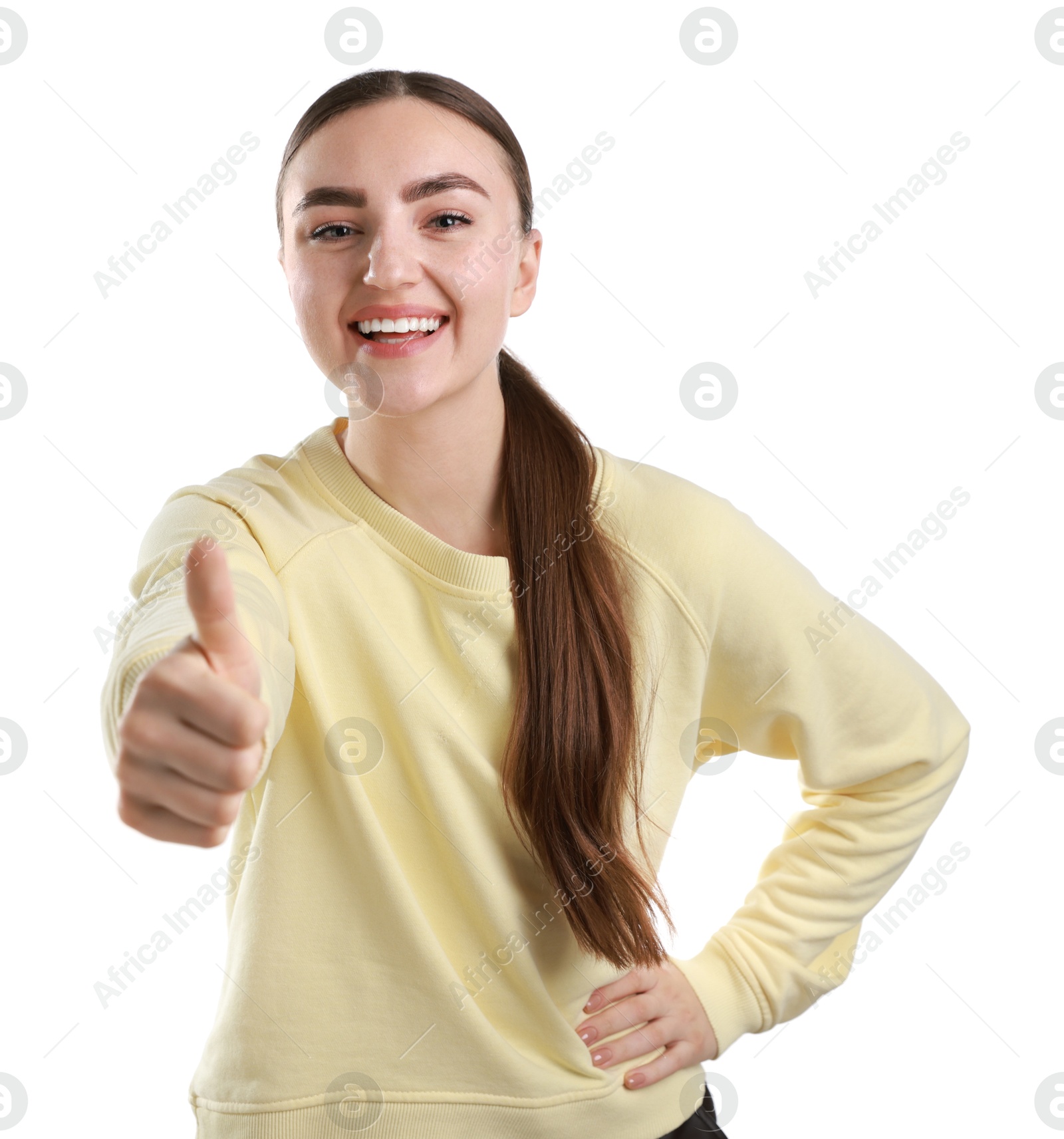 Photo of Happy woman showing thumbs up on white background. Like gesture