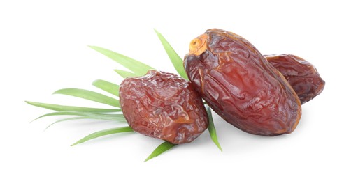 Photo of Tasty dried dates and leaf isolated on white