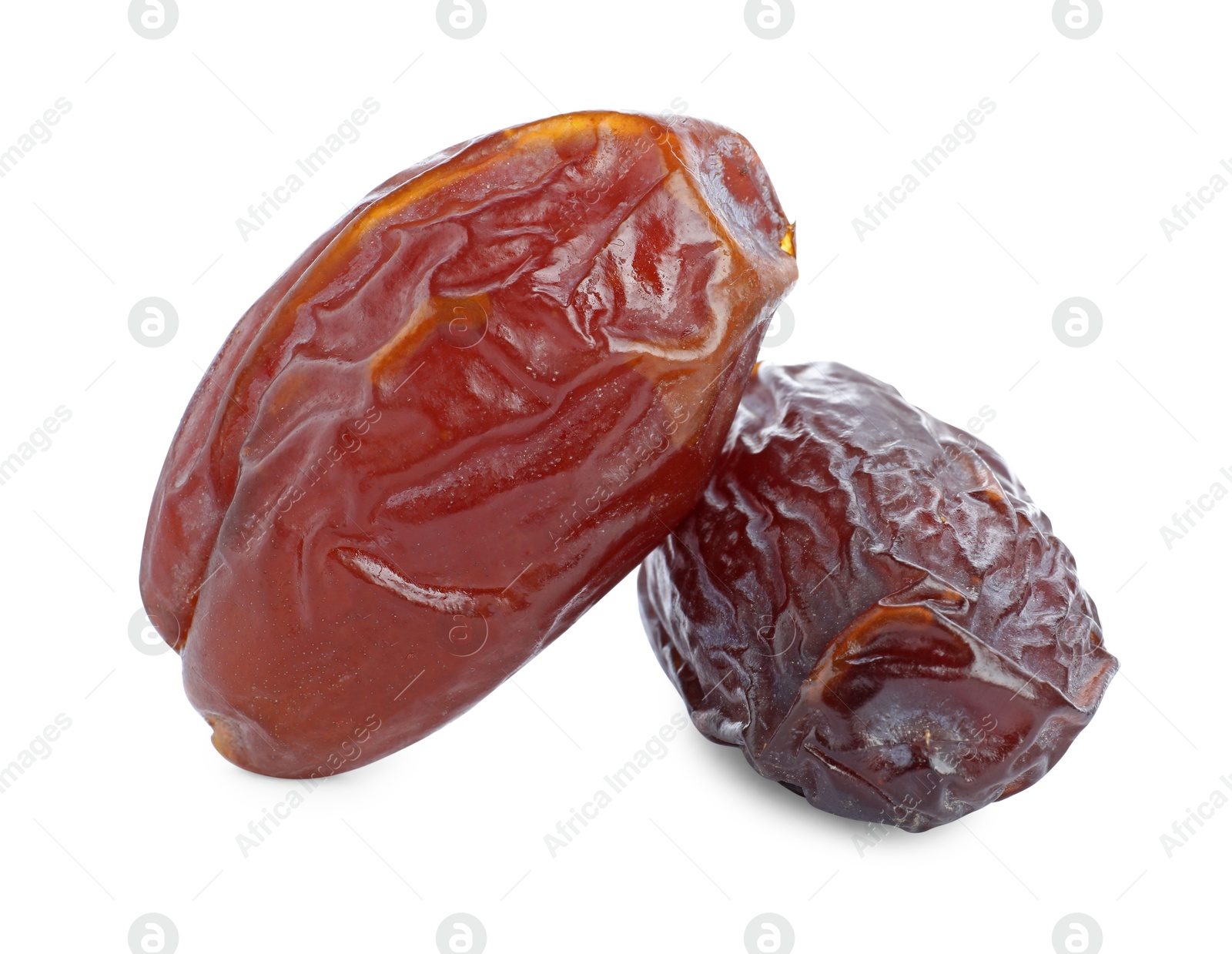 Photo of Two tasty dried dates isolated on white