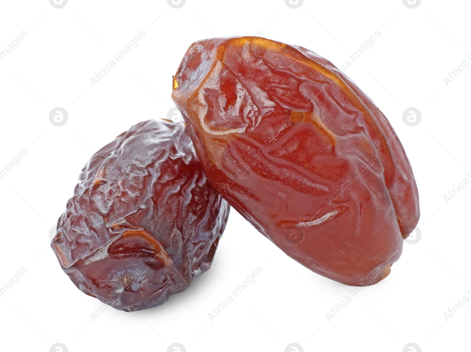 Photo of Two tasty dried dates isolated on white