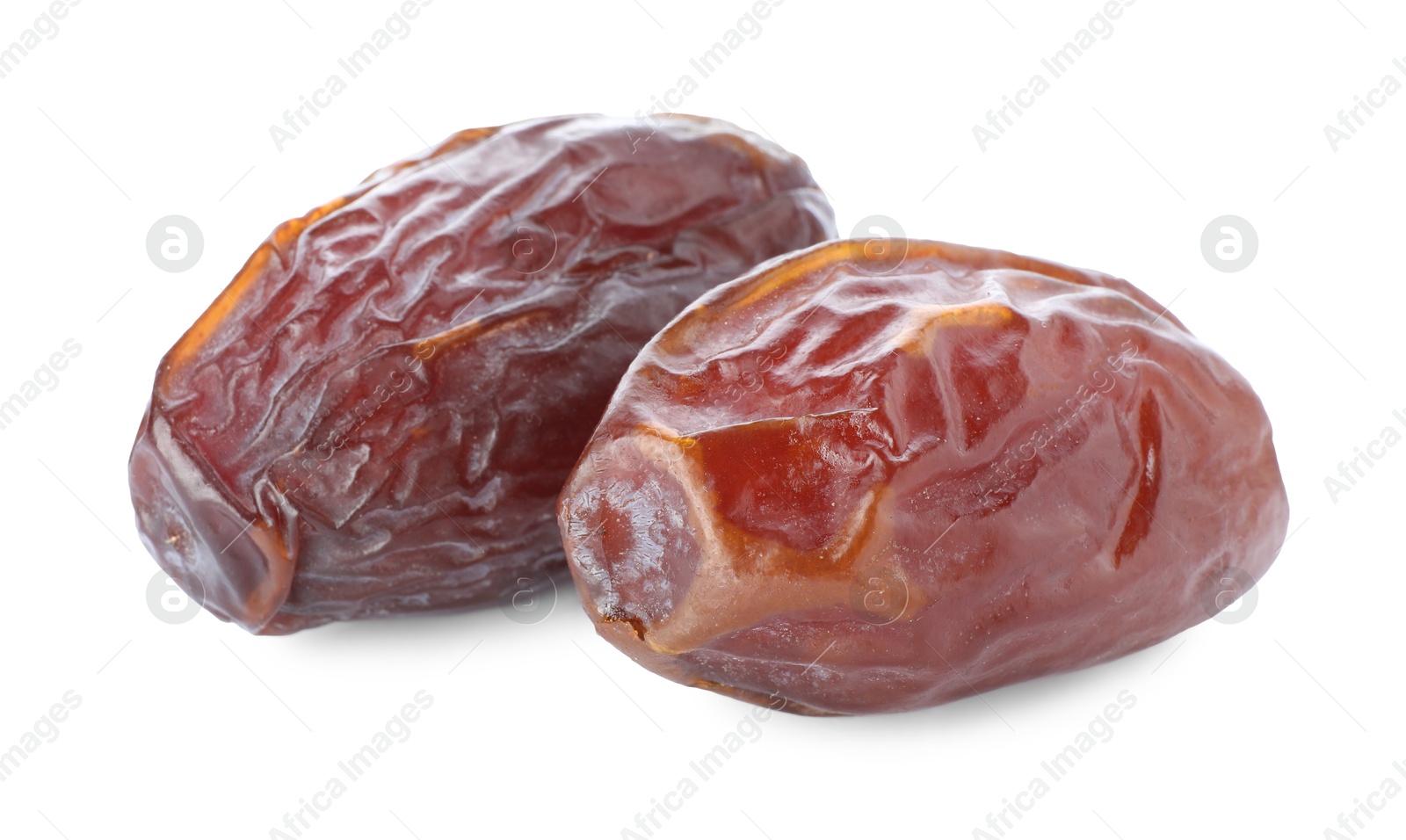 Photo of Two tasty dried dates isolated on white