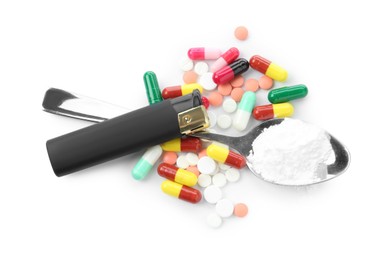 Photo of Drug addiction. Different pills, spoon with powder and cigarette lighter isolated on white, top view