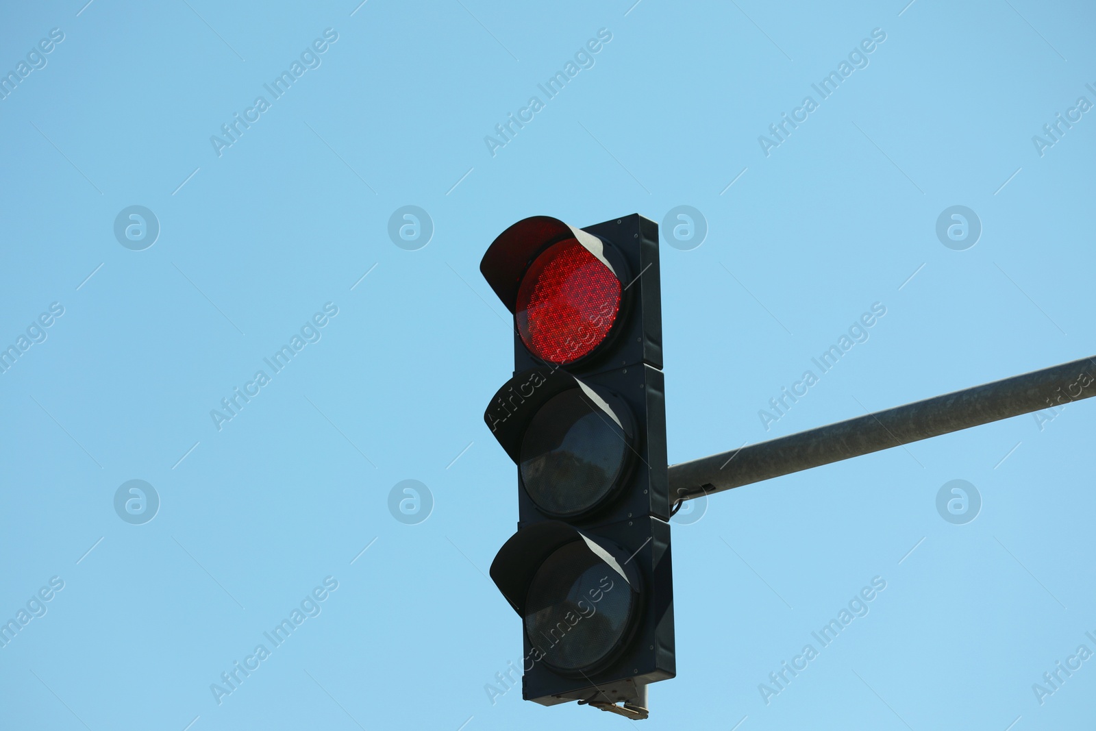 Photo of View of traffic light against blue sky