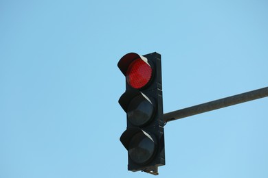 Photo of View of traffic light against blue sky