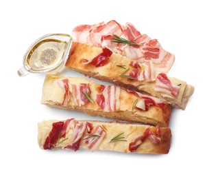 Photo of Slices of delicious focaccia bread with bacon, rosemary and oil isolated on white, top view