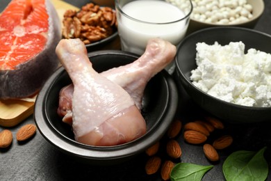 Photo of Different fresh products rich in estrogen on grey table