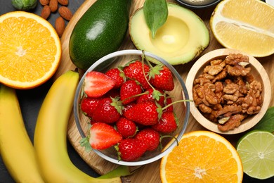 Photo of Different fresh products rich in dopamine on grey table, flat lay