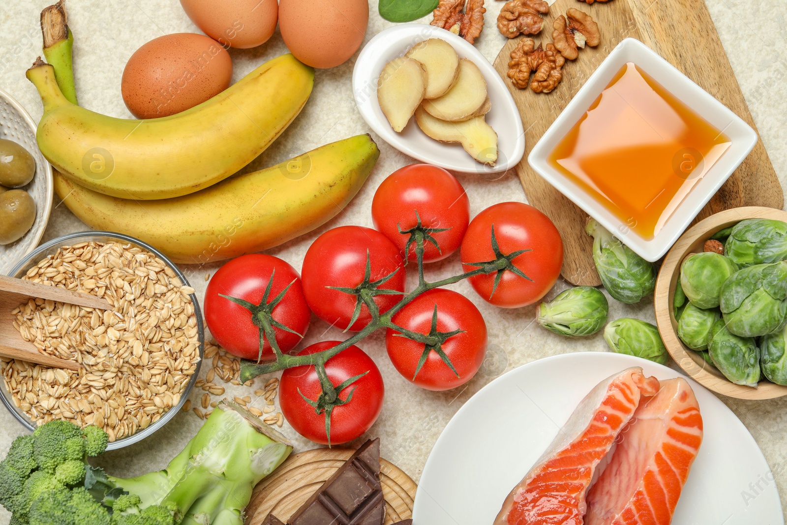 Photo of Different fresh products rich in melatonin on light table, flat lay