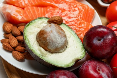 Photo of Different products rich in serotonin as background, closeup