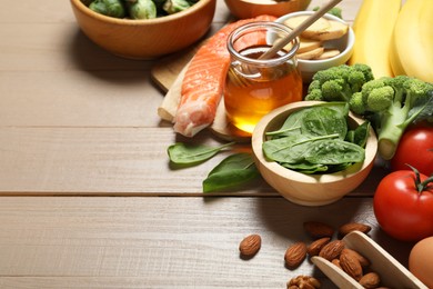 Photo of Different products rich in melatonin on wooden table, closeup