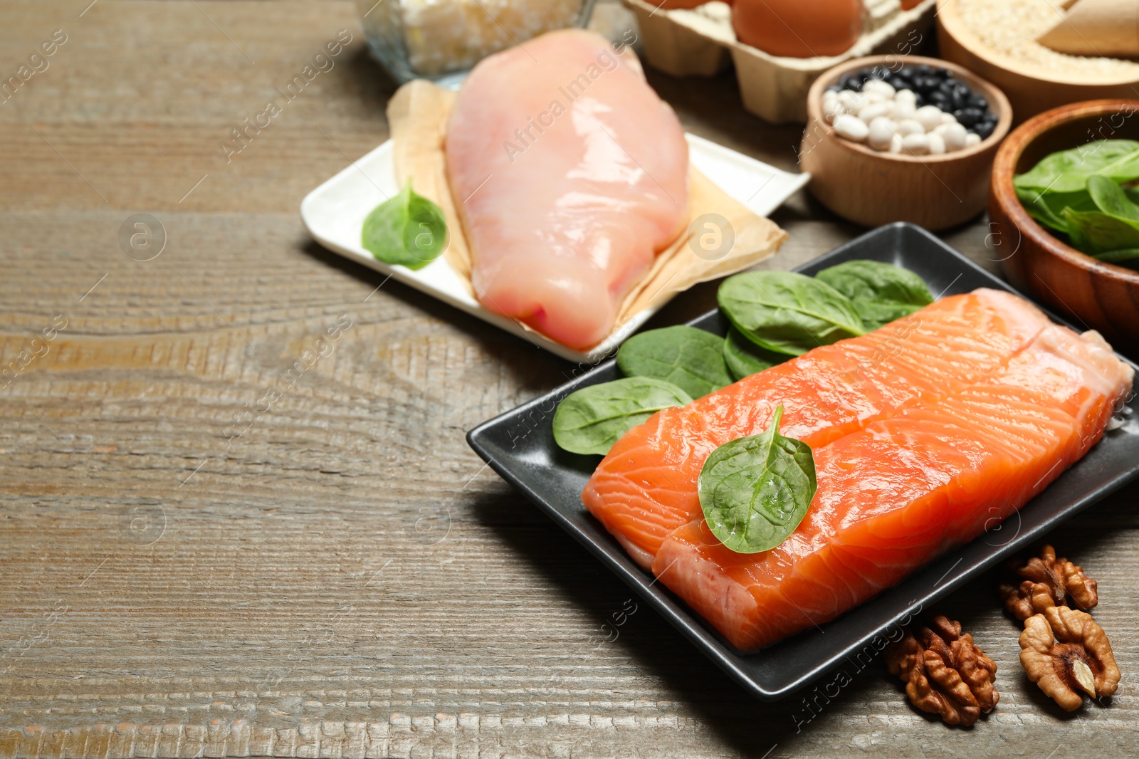 Photo of Different products rich in estrogen on wooden table