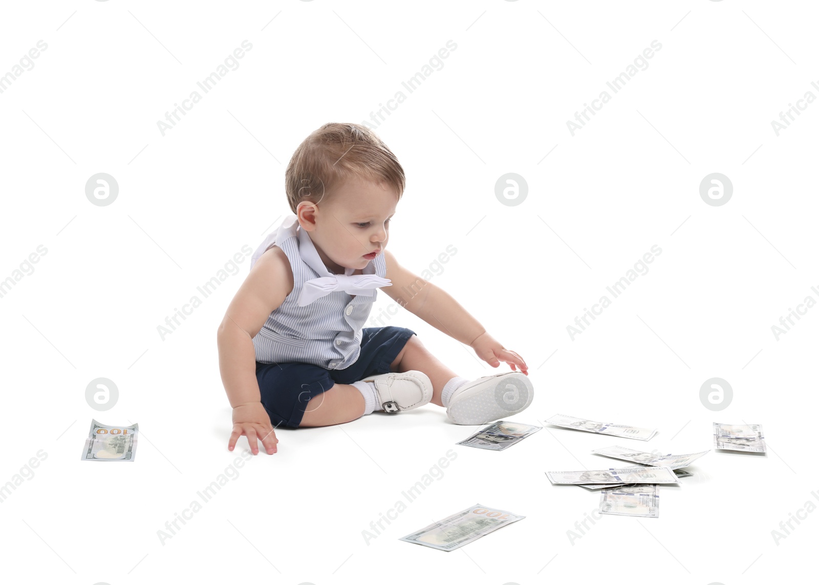 Photo of Little baby with money on white background