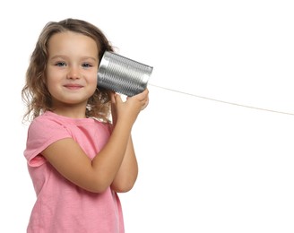 Photo of Girl using tin can telephone on white background