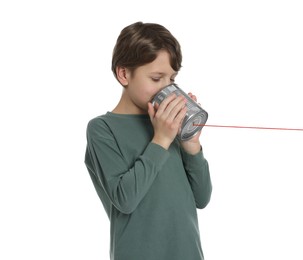 Boy using tin can telephone on white background