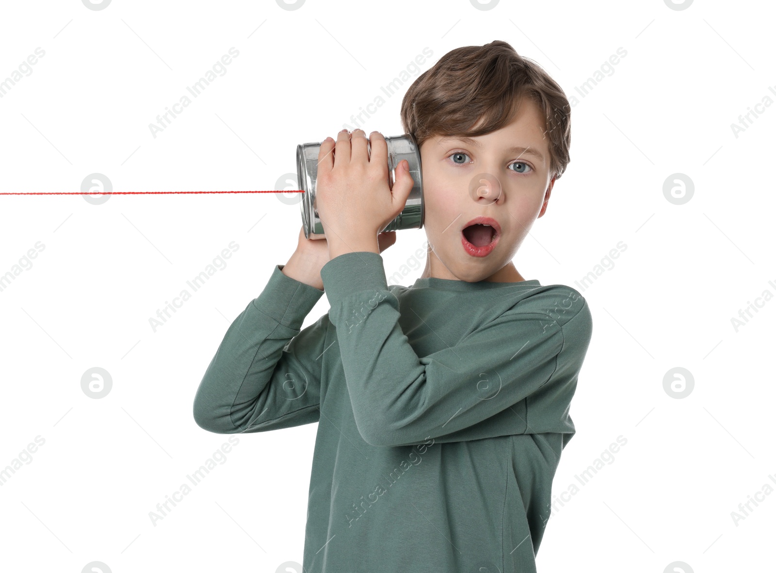 Photo of Emotional boy using tin can telephone on white background