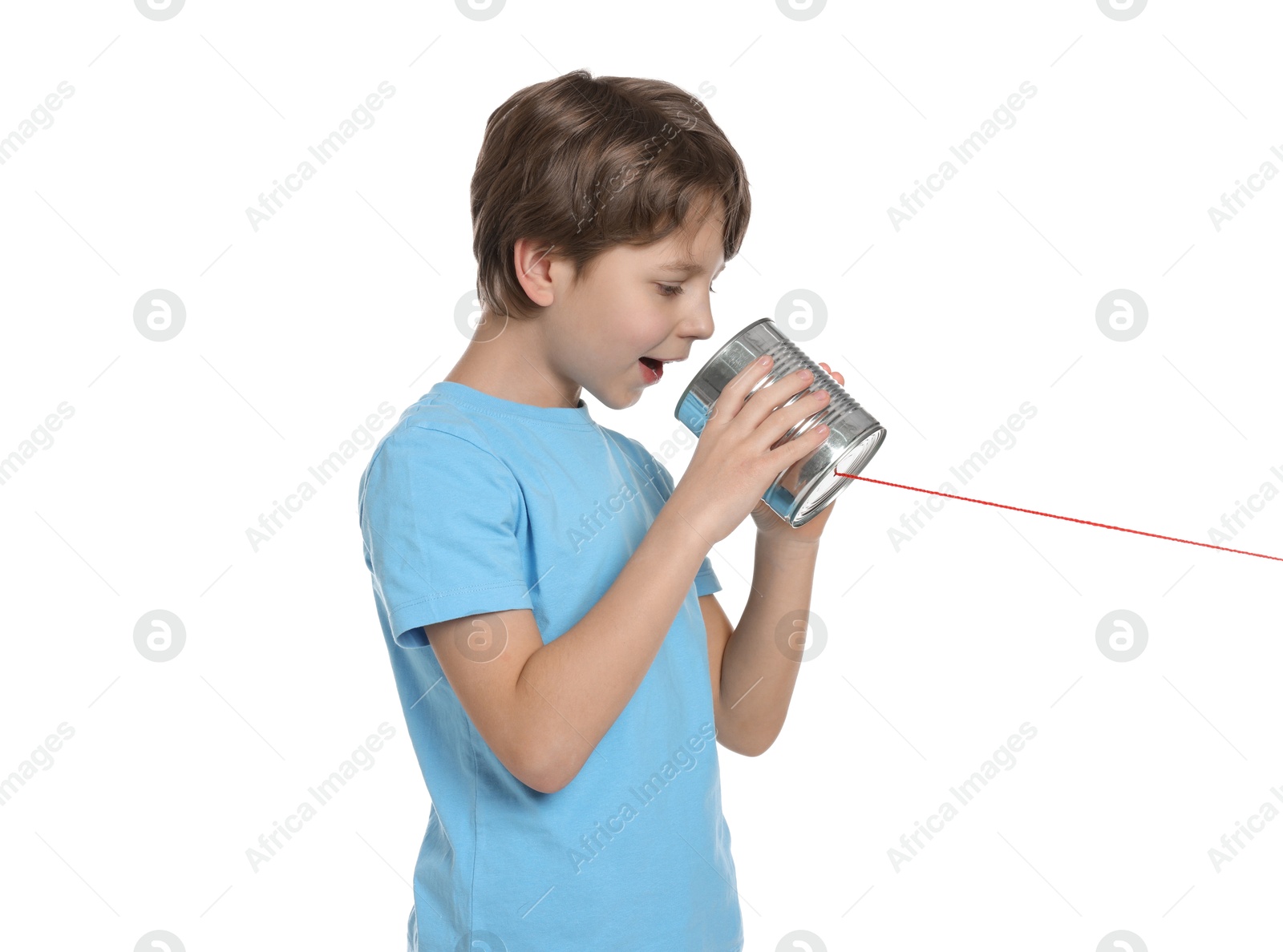 Photo of Boy using tin can telephone on white background