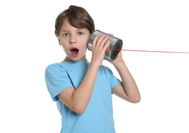 Photo of Emotional boy using tin can telephone on white background