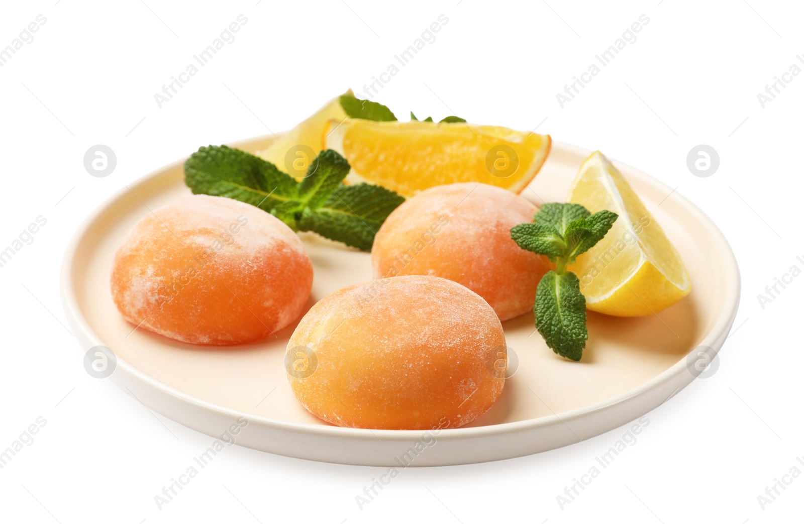 Photo of Plate with tasty mochi, cut orange, lemon and mint isolated on white