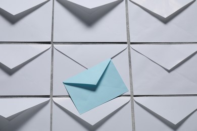 Photo of Paper envelopes on gray background, top view. Mockup for design