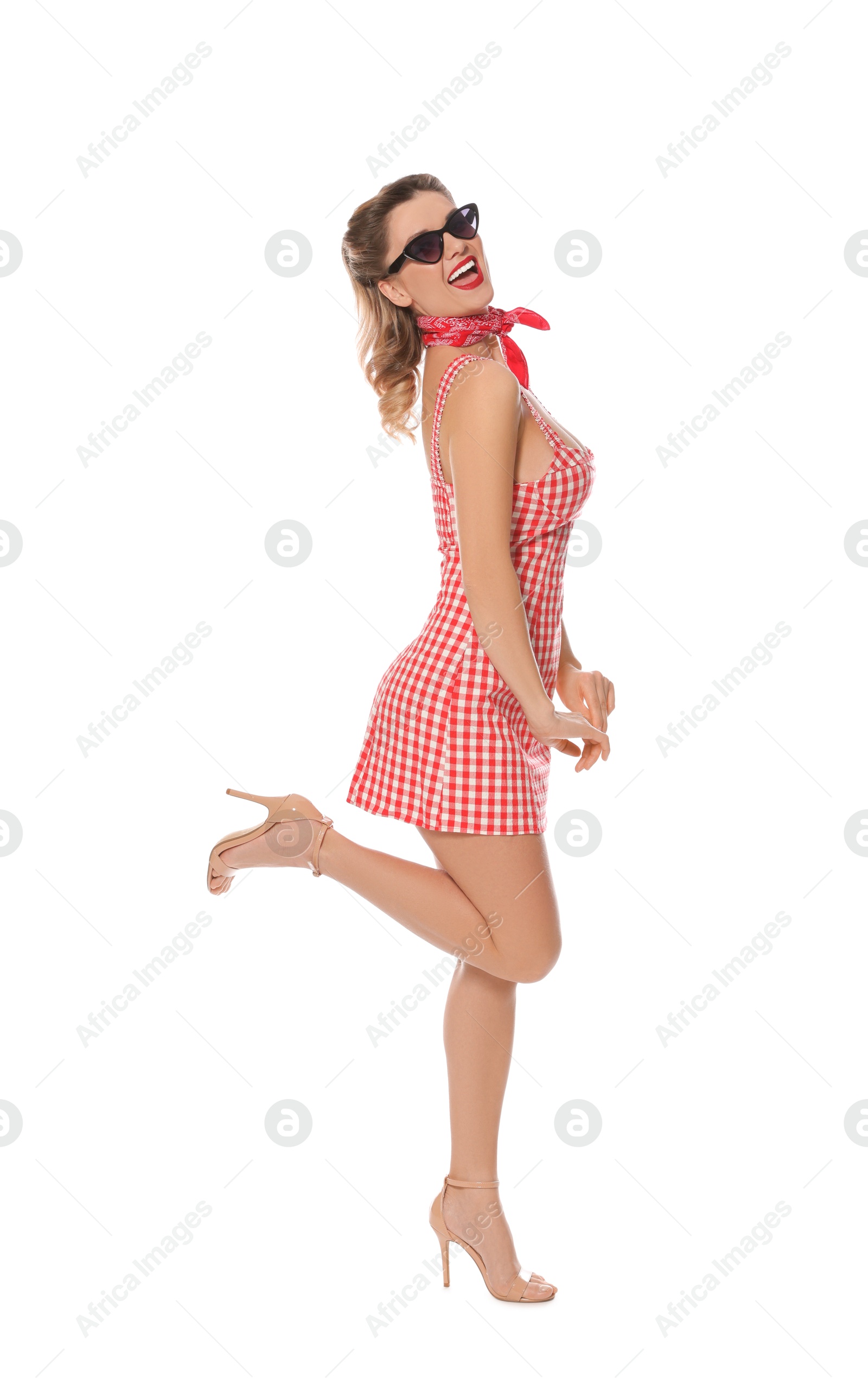 Photo of Happy pin-up woman in dress posing on white background