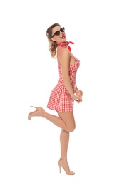 Happy pin-up woman in dress posing on white background