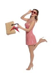 Photo of Happy pin-up woman in dress posing on white background