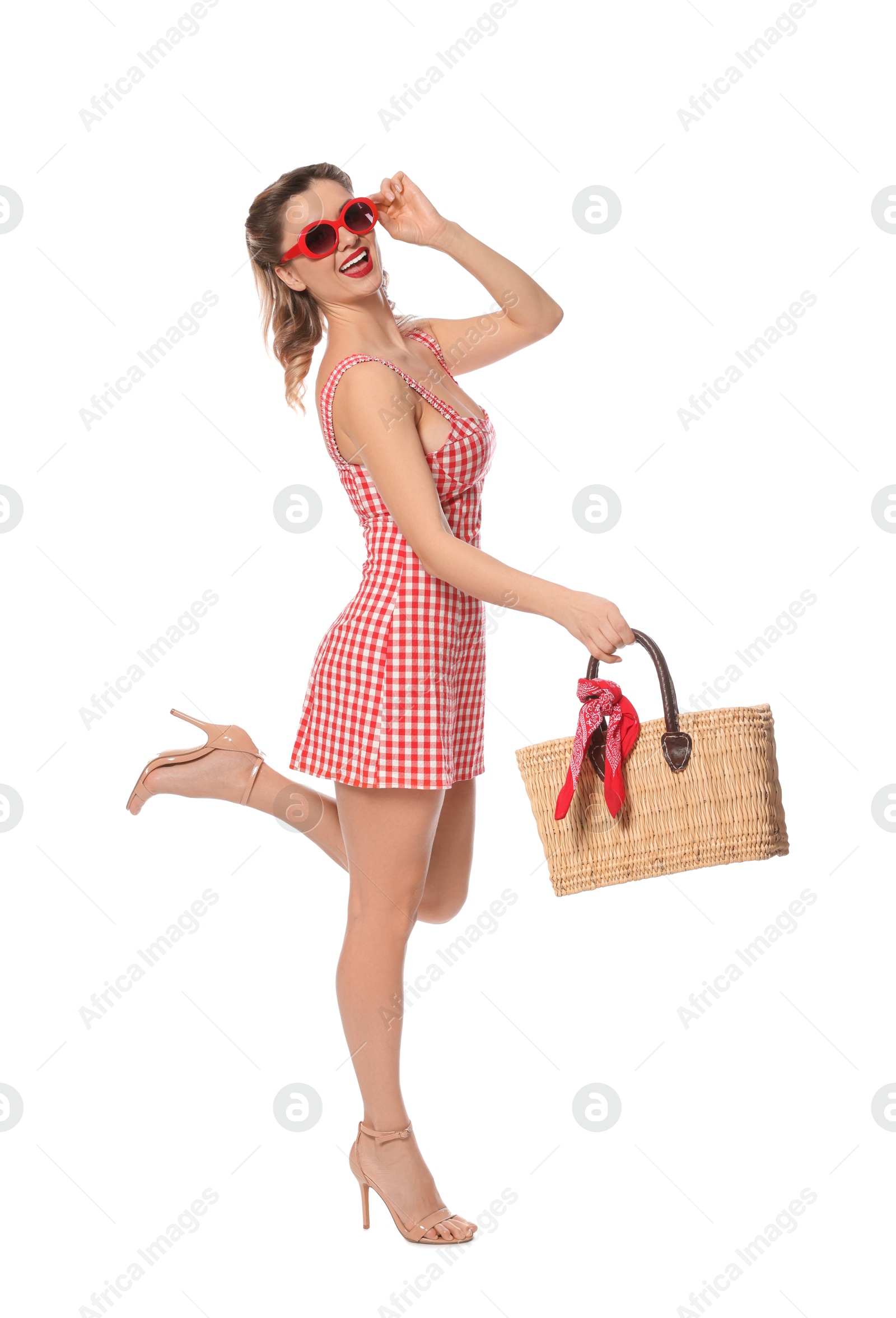 Photo of Happy pin-up woman in dress posing on white background