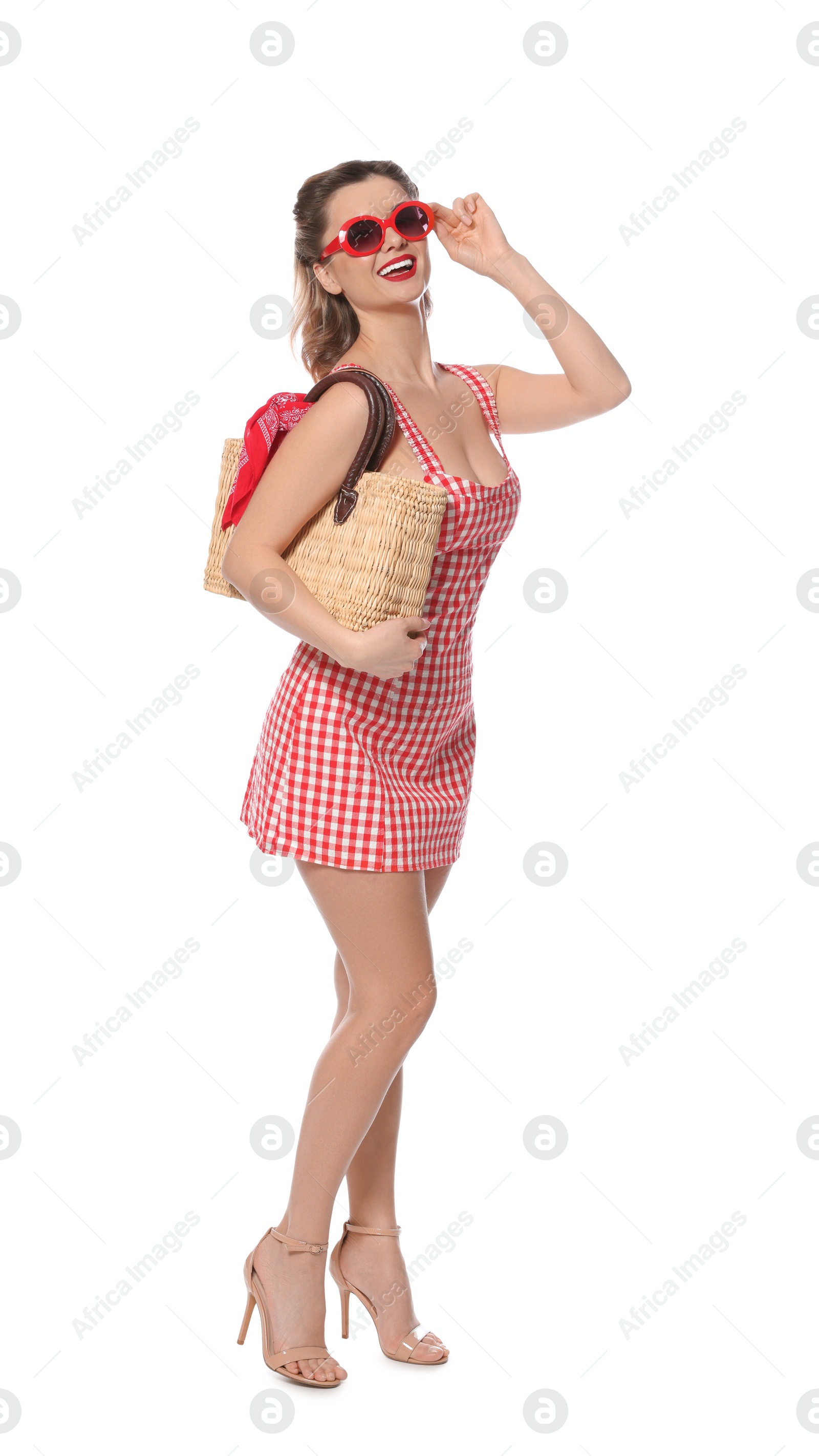 Photo of Happy pin-up woman in dress posing on white background