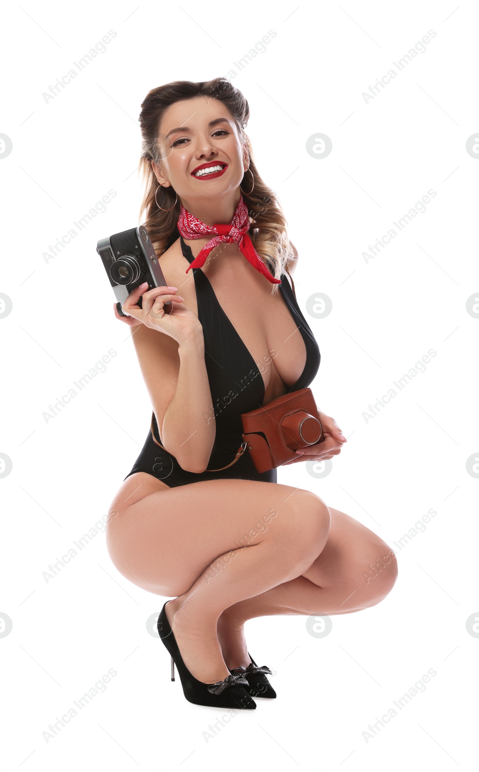 Photo of Happy pin-up woman in swimsuit with vintage camera on white background