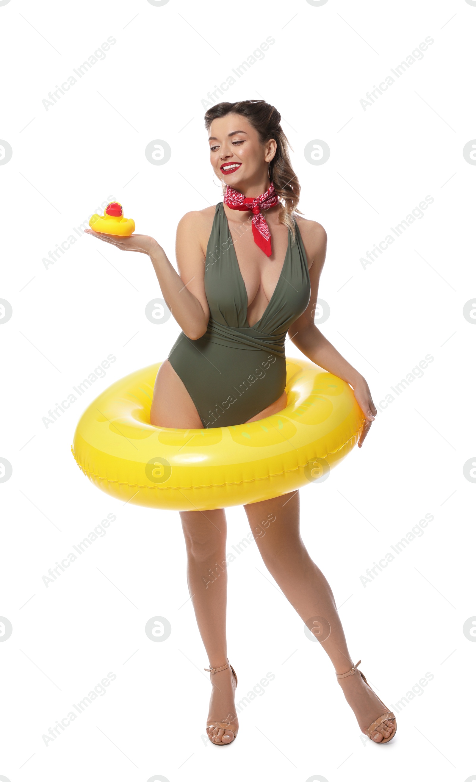 Photo of Happy pin-up woman in swimsuit with rubber duck and inflatable ring on white background