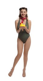 Photo of Happy pin-up woman in swimsuit with rubber duck on white background