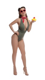 Photo of Happy pin-up woman in swimsuit with rubber duck on white background