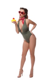 Photo of Attractive pin-up woman in swimsuit with rubber duck on white background