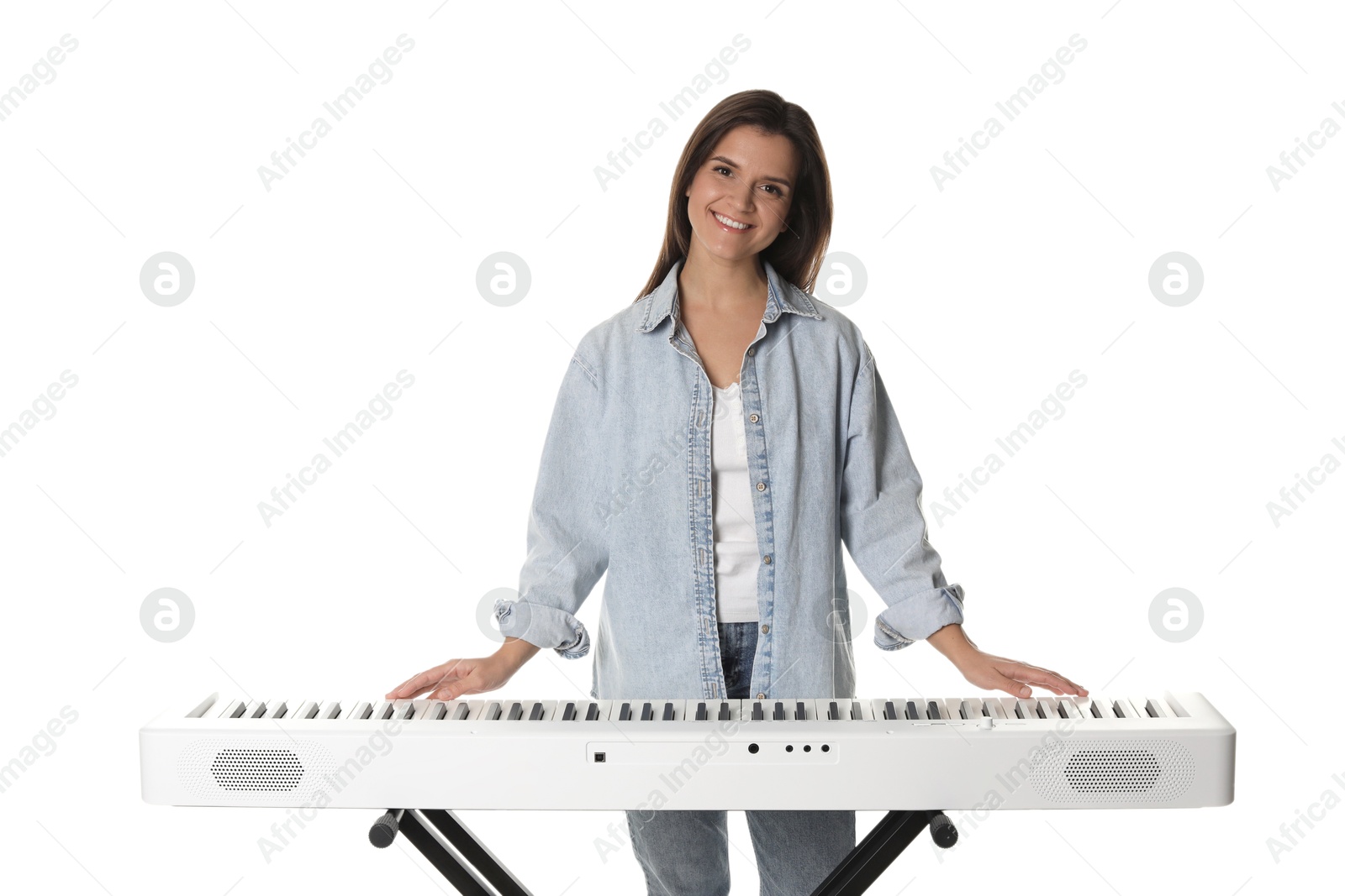 Photo of Smiling woman playing synthesizer on white background