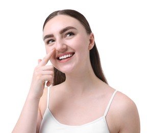 Woman touching her nose on white background