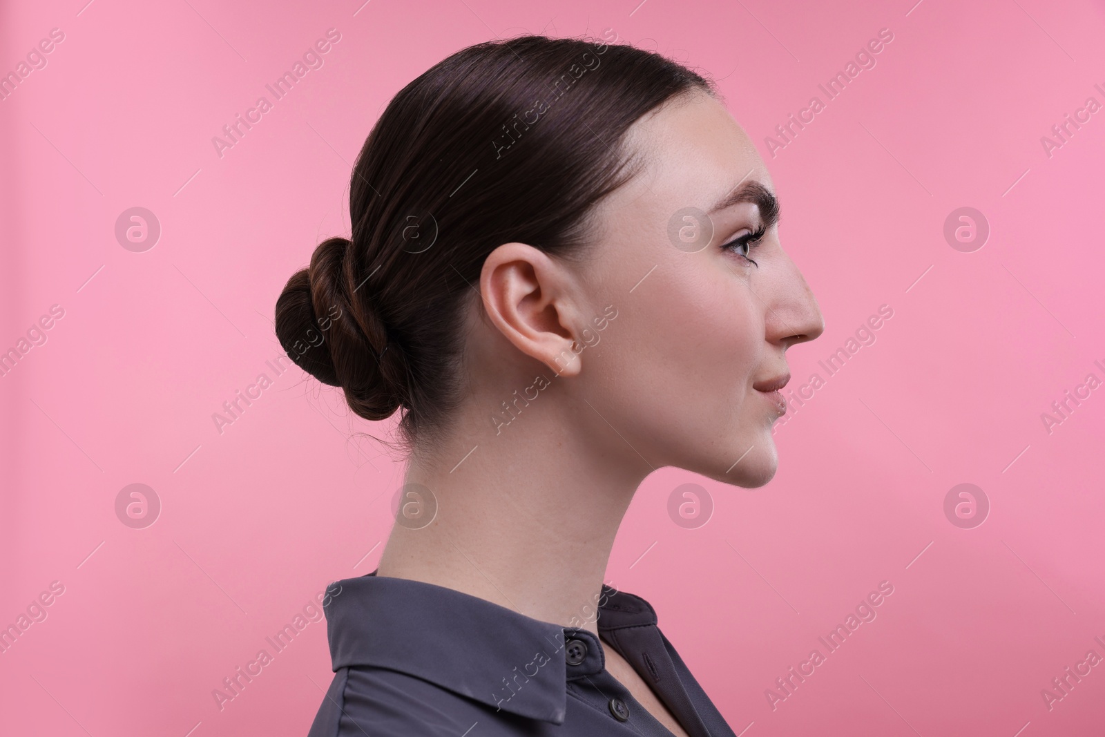 Photo of Portrait of beautiful woman on pink background