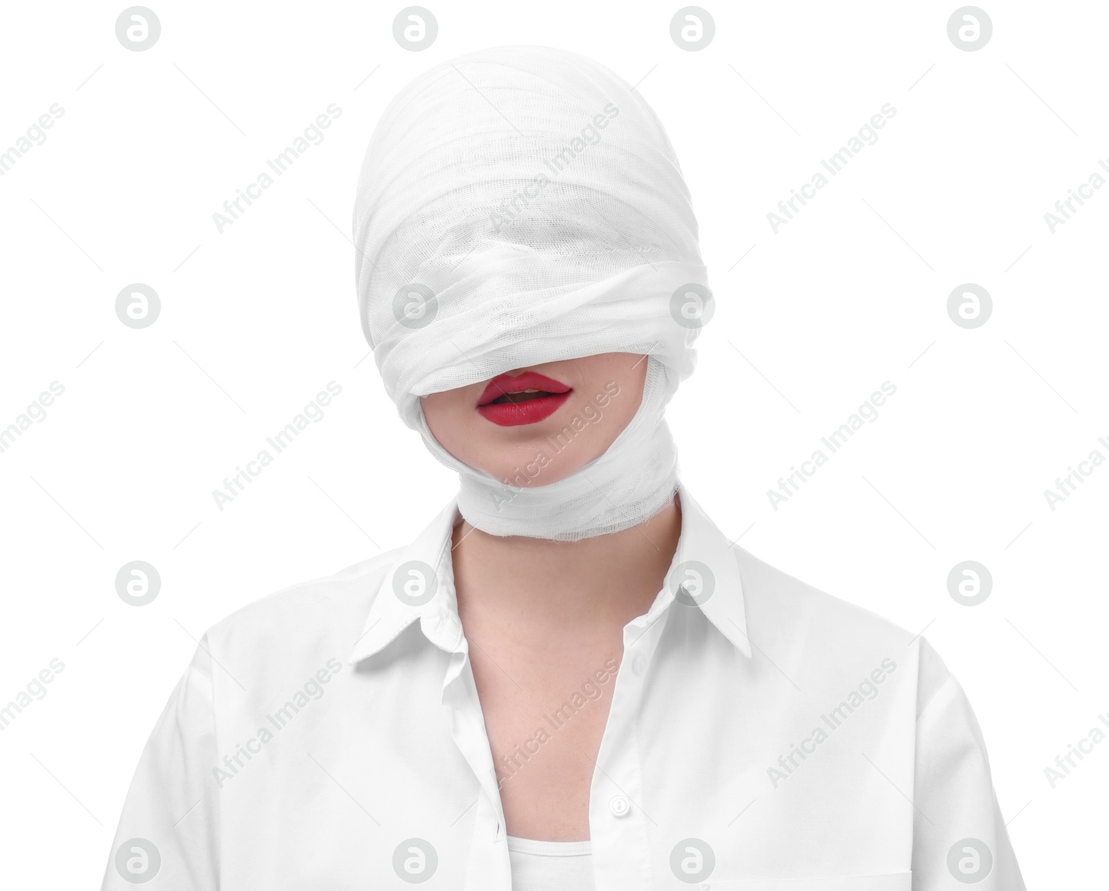 Photo of Woman with face wrapped in medical bandage after plastic surgery operation on white background