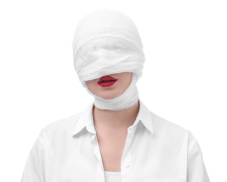 Photo of Woman with face wrapped in medical bandage after plastic surgery operation on white background