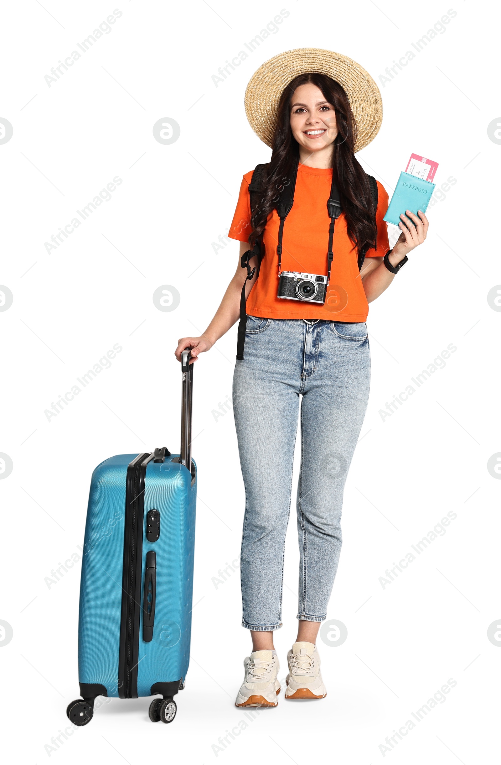 Photo of Young tourist in hat with camera, suitcase, passport, ticket and backpack on white background, space for text