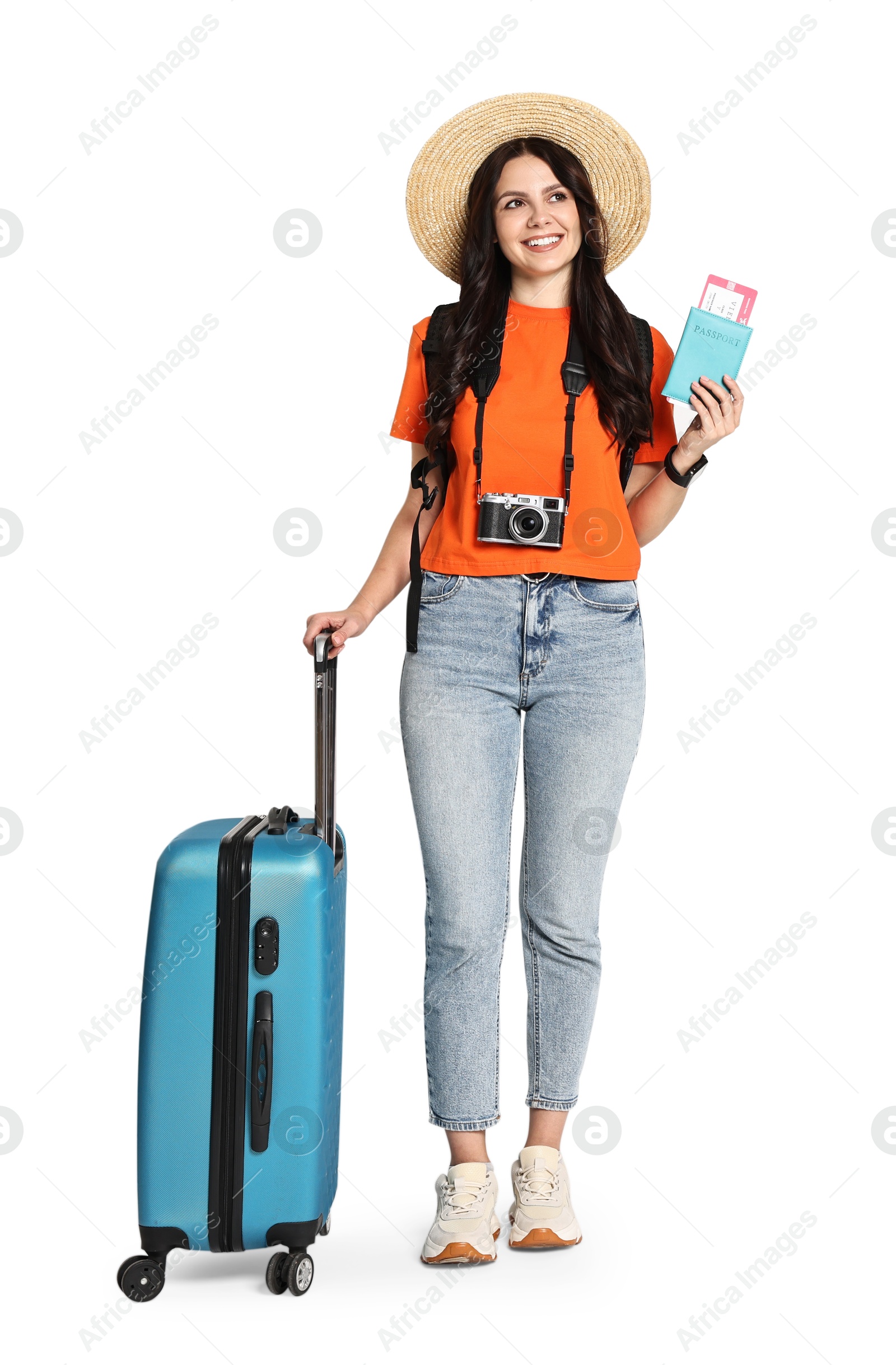 Photo of Young tourist in hat with camera, suitcase, passport, ticket and backpack on white background, space for text