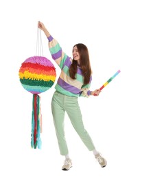 Photo of Happy woman with colorful pinata and stick isolated on white