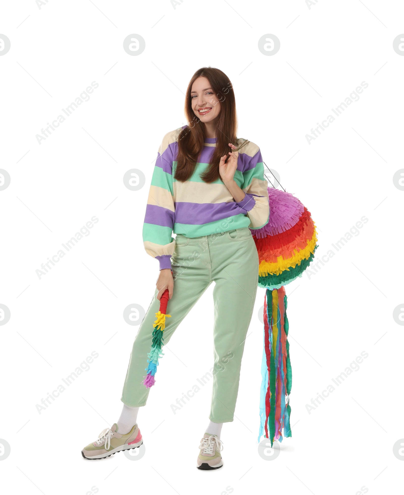 Photo of Happy woman with colorful pinata and stick isolated on white