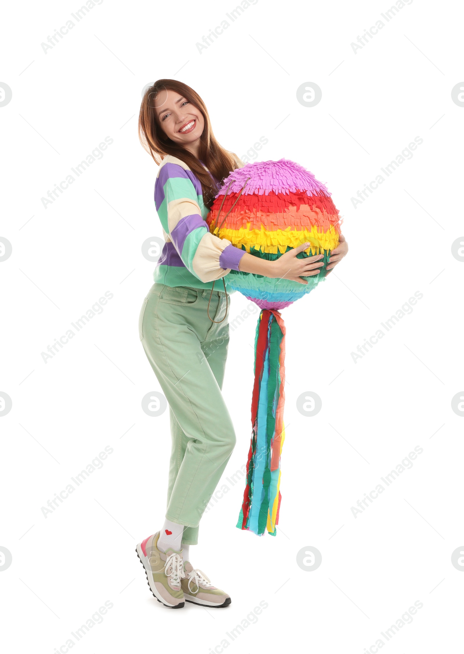 Photo of Happy woman with colorful pinata isolated on white