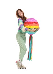 Happy woman with colorful pinata isolated on white