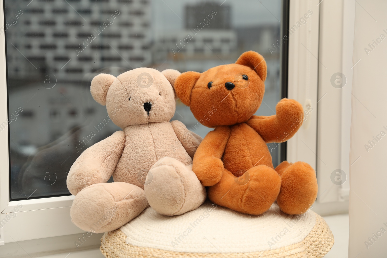 Photo of Teddy bears on window sill at home