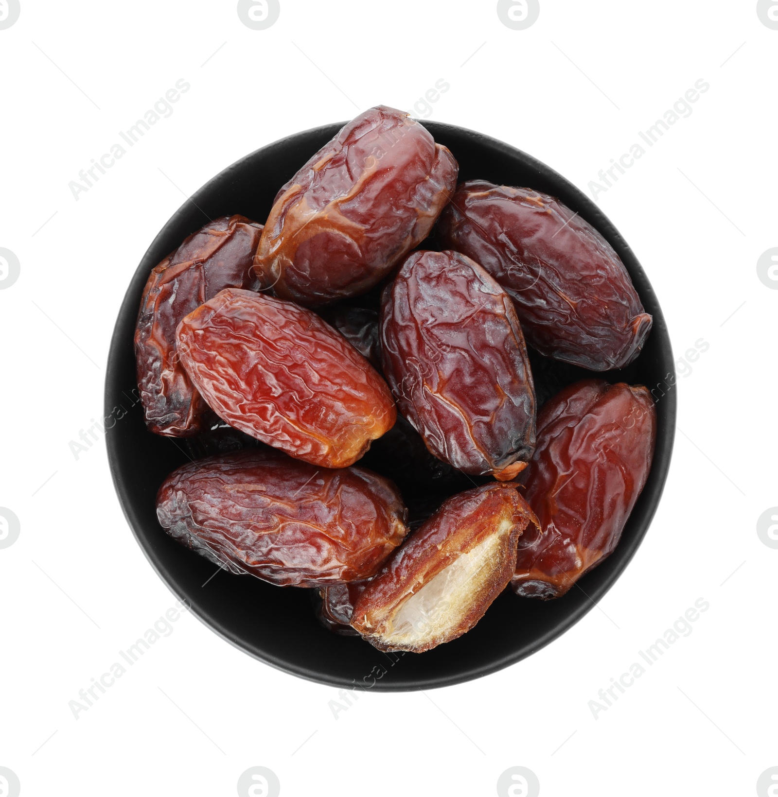 Photo of Tasty dried dates in bowl isolated on white, top view