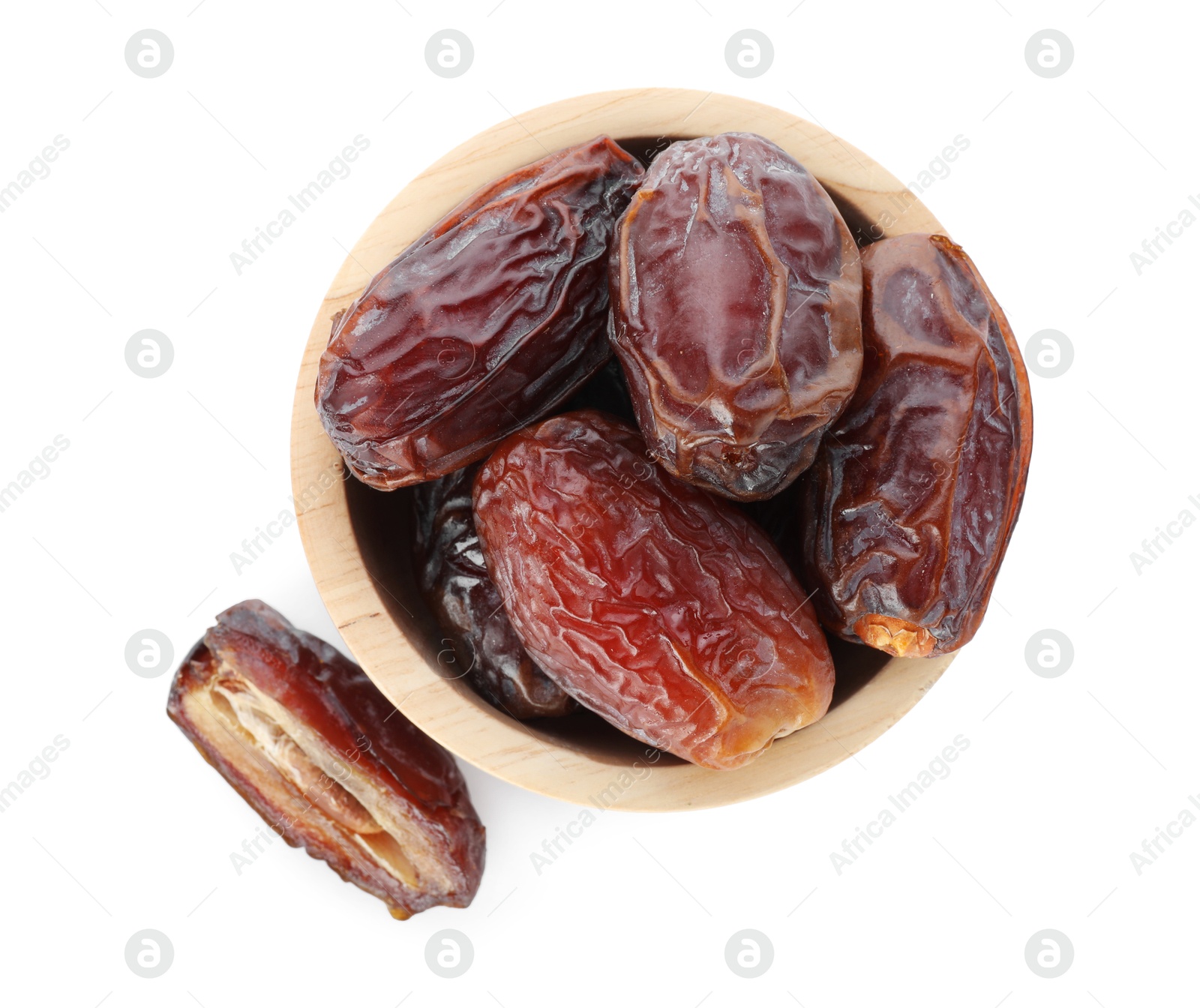 Photo of Tasty dried dates in bowl isolated on white, top view