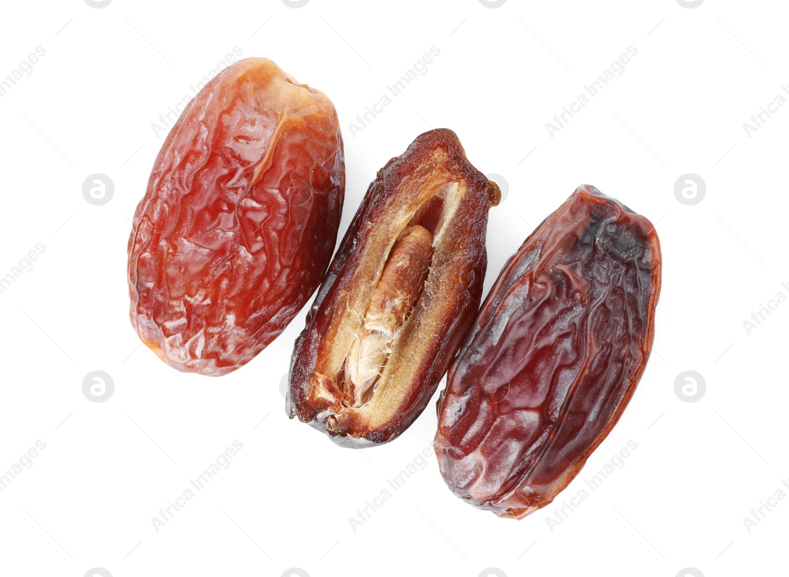 Photo of Three tasty dried dates isolated on white, top view